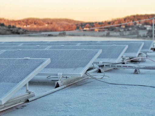 Photovoltaic-solar-panels-fixed-on-bitumen-flat-roof-terrace-1